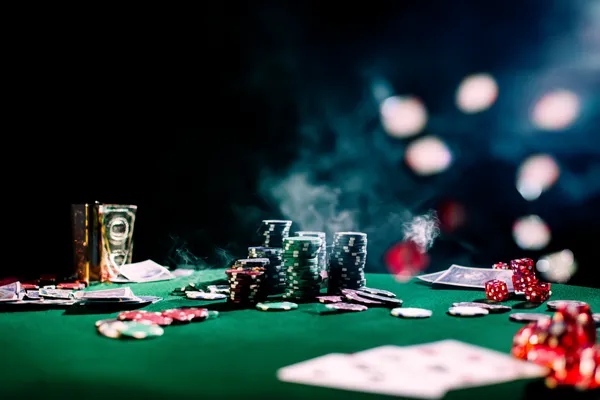 A close-up shot of golden coins falling around a spinning roulette wheel, representing immersive casino action at KWIKIBET.