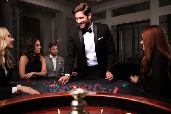 A person using their device against a moody casino-themed background, illustrating the smooth re-entry process at KWIKIBET.